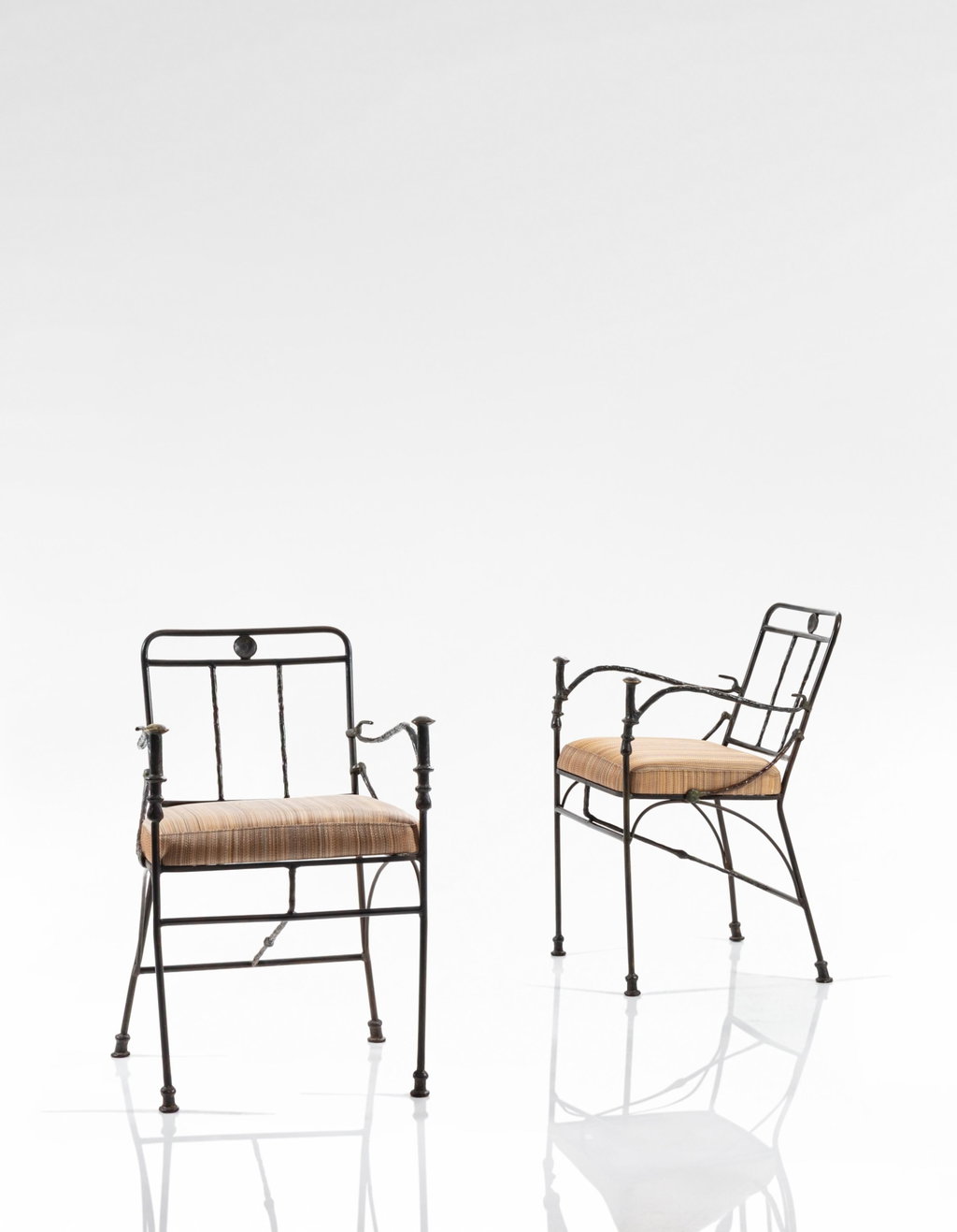 Pair of Pommeaux de Canne armchairs, special commission (1963) by Diego Giacometti estimated at $579,900 (low) to $811,800 (high). Image courtesy of Sotheby's