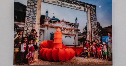Why this artist wears a hijab and a 328-foot-long garment that looks like a millipede