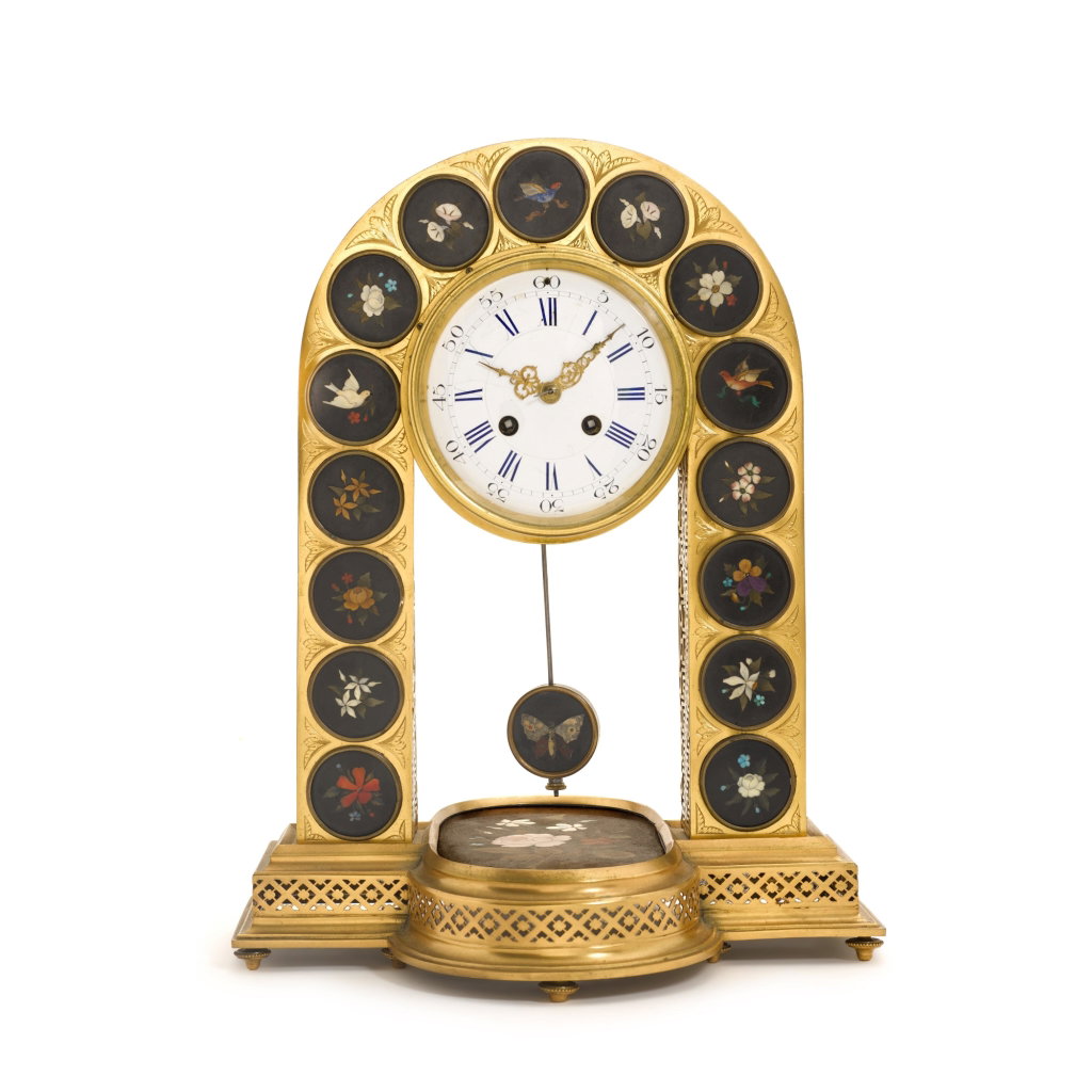 A gilt-brass and pietra dura mantel clock by Italian or French, circa sold for $7,302. Image courtesy of Sotheby's