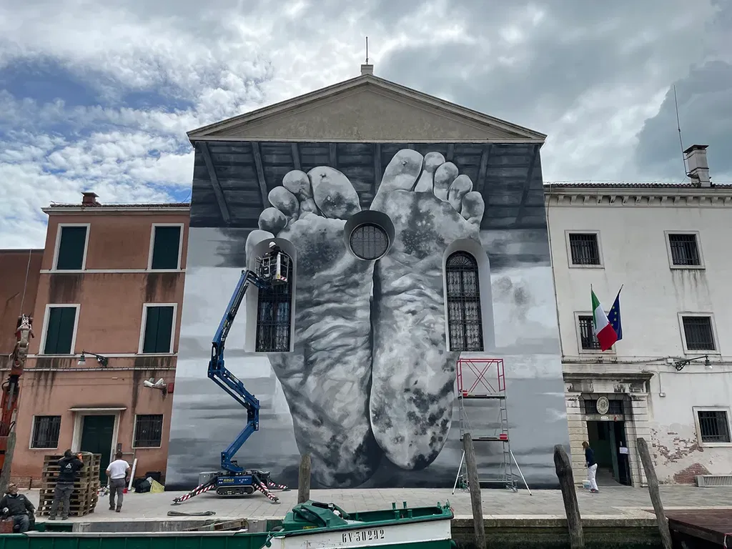 Maurizio Cattelan's mural welcomed visitors to the Pavilion of the Holy See at the Venice Biennale, which was presented in a women's prison. Photograph by Lucas Blalock
