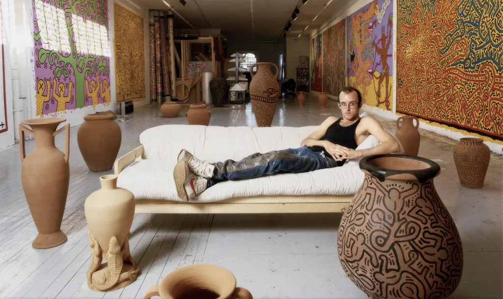 Keith Haring in his New York studio. Photography by Tseng Kwong Chi. Copyright the artist/Muna Tseng Dance Projects Inc. Art courtesy of the Keith Haring Foundation.
