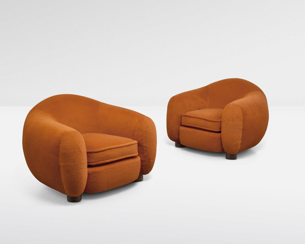 Pair of 'Boule' armchairs, also known as 'Polar Bear' armchairs by Jean Royere estimated at $586,800 (low) to $704,200 (high). Image courtesy of Christie's