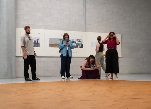 Visitor licks peanut butter installation