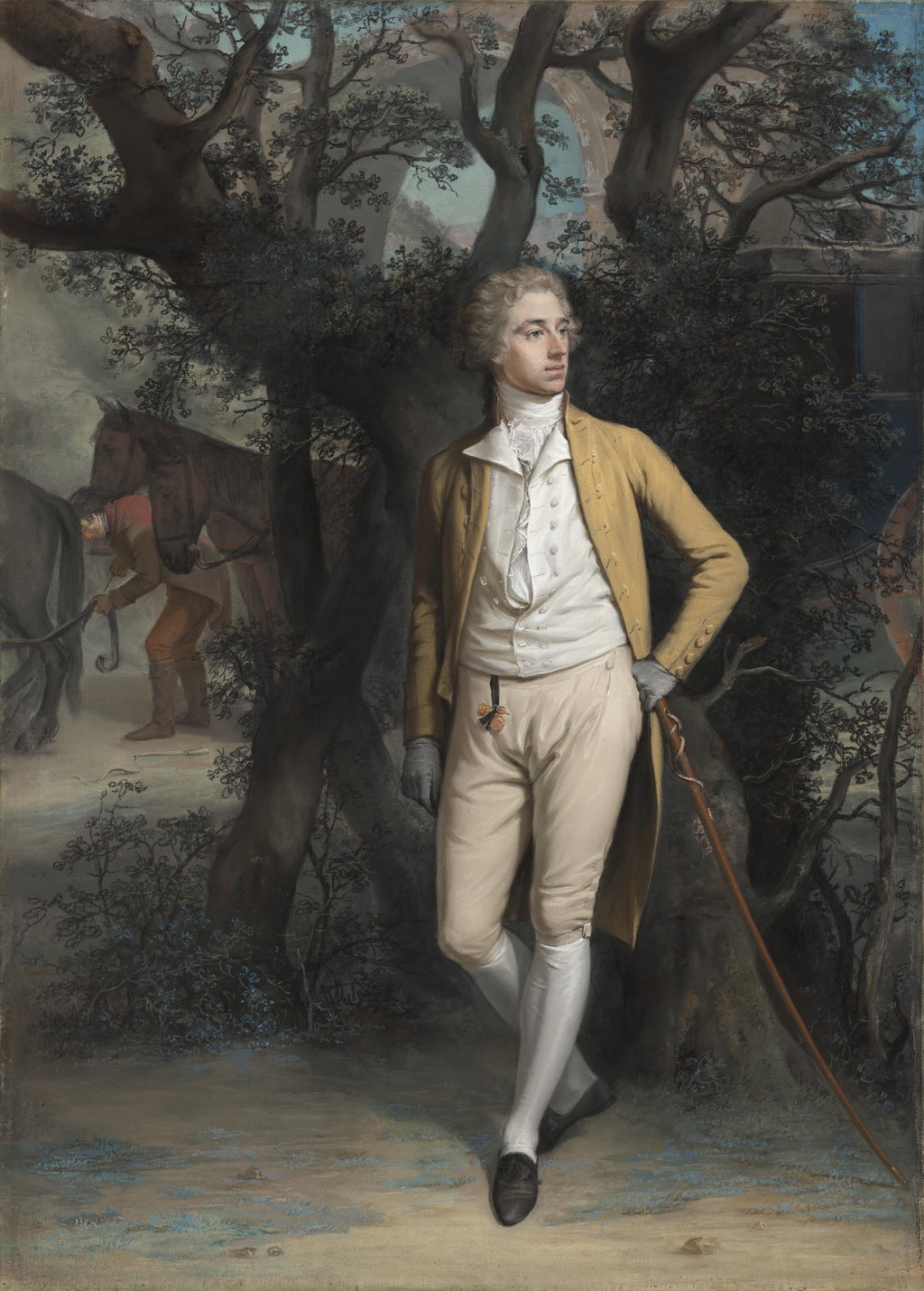 Portrait of a gentleman, traditionally identified as Arthur Hill, 2nd Marquess of Downshire (1753-1801), small full-length, in a yellow frock coat and breeches, his left arm resting on his cane, a coach and four beyond, in a classical landscape. Image courtesy of Christie's