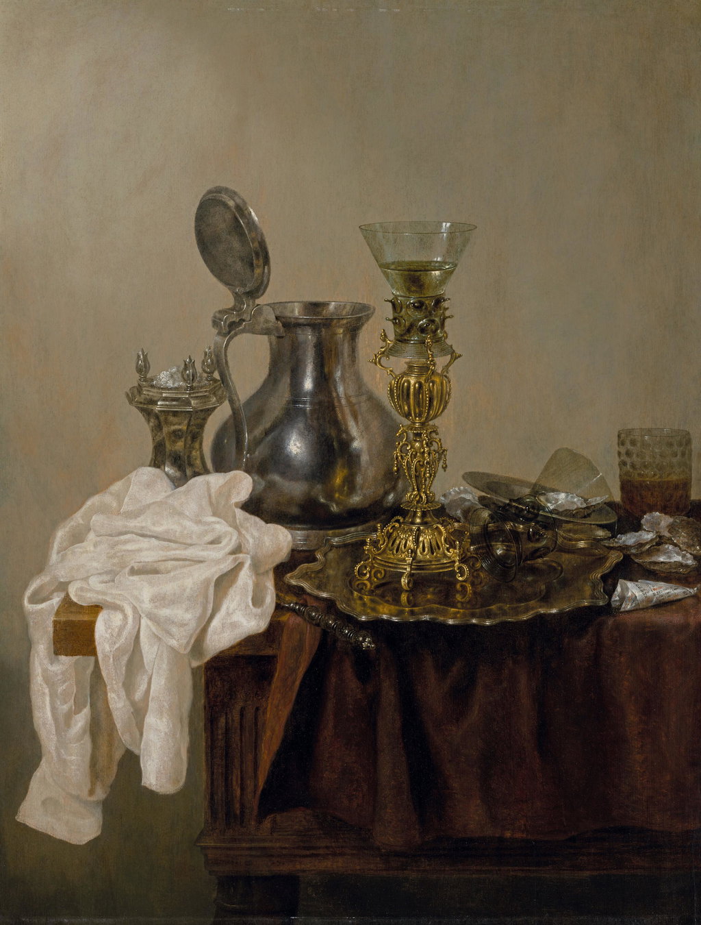 A pewter flagon, a salt cellar, a roemer with silver-gilt stem, an upturned glass roemer, oysters, and a dish on a partly draped table. Image courtesy of Christie's