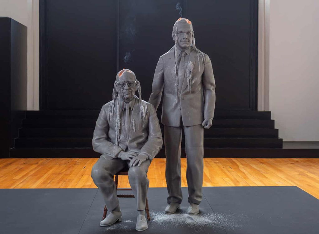 Jeremy Deller's life-size Rupert and Lachlan Murdoch candles burn in Melbourne installation