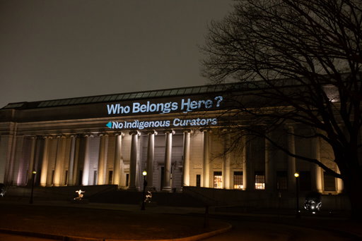 “Who Belongs Here?” Guerrilla Protest Projection Critiques MFA Layoffs