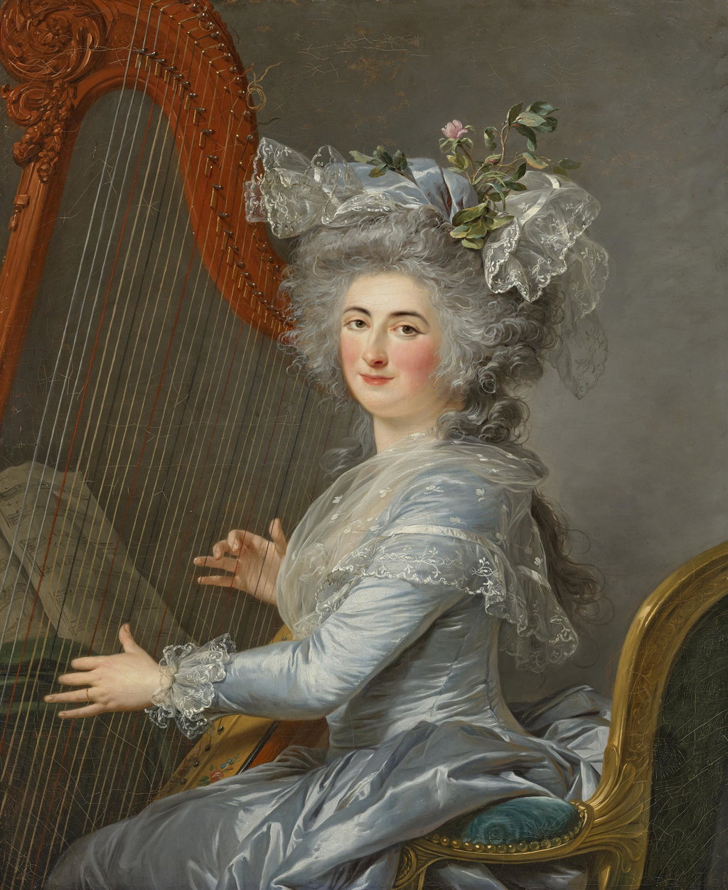Portrait of Marquise Marie-Thérèse-Odile de la Valette (1761-1788), half-length, seated, in a silver grey satin dress with a lace shawl and bonnet, playing a harp. Image courtesy of Christie's